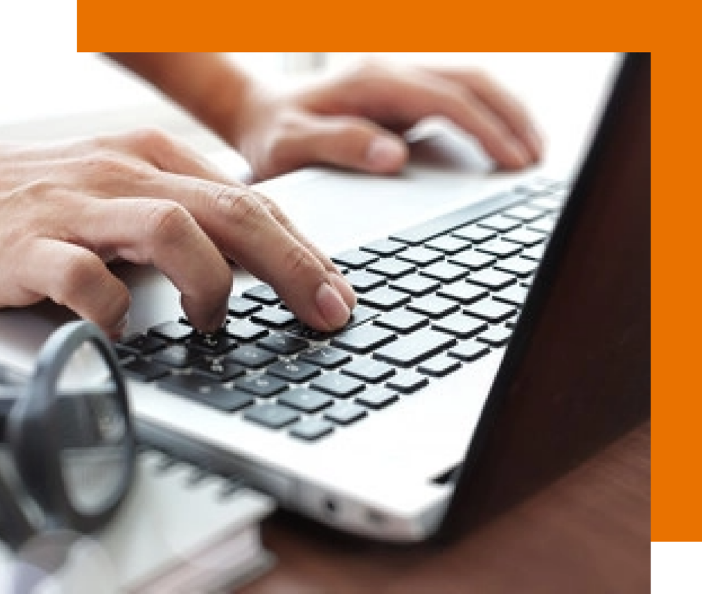 Typing on a laptop