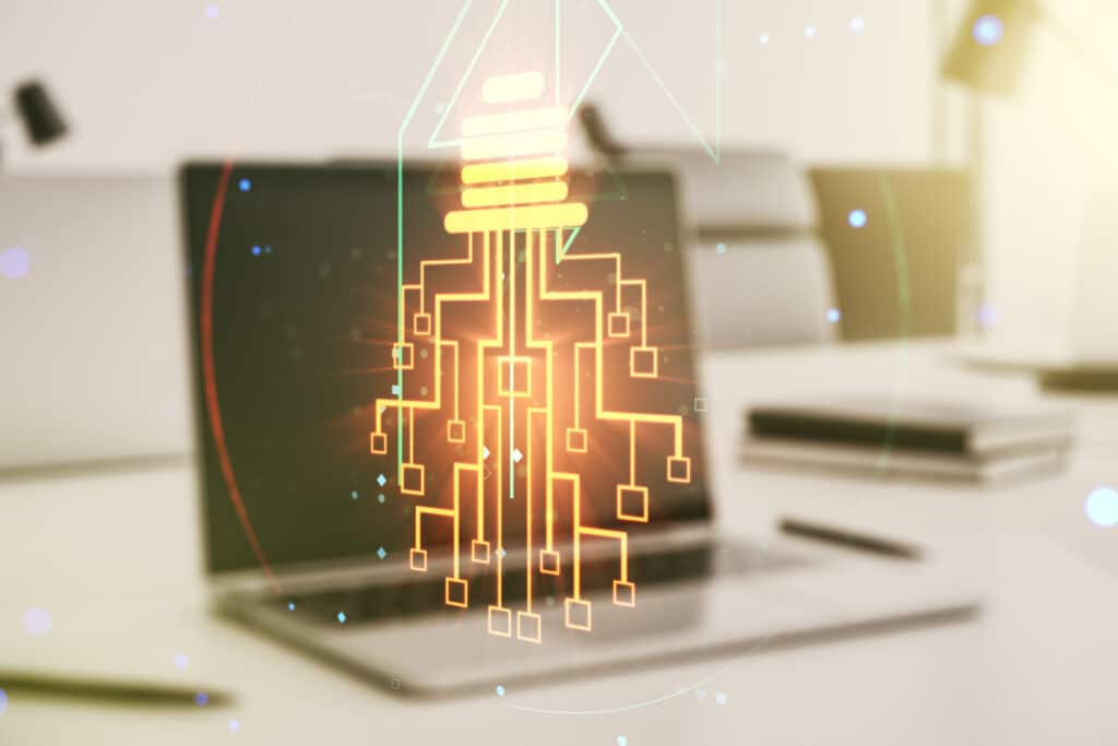 Creative idea concept with light bulb and microcircuit illustration on modern laptop background