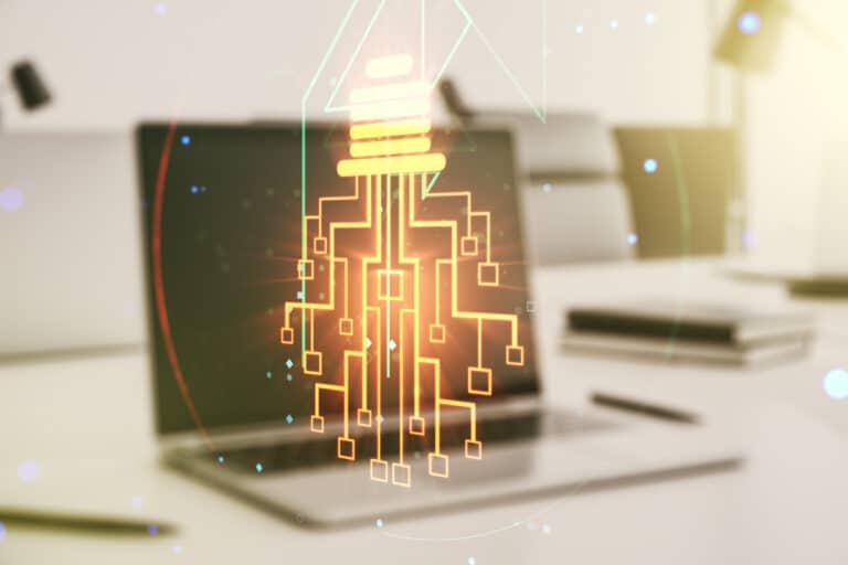 Creative idea concept with light bulb and microcircuit illustration on modern laptop background