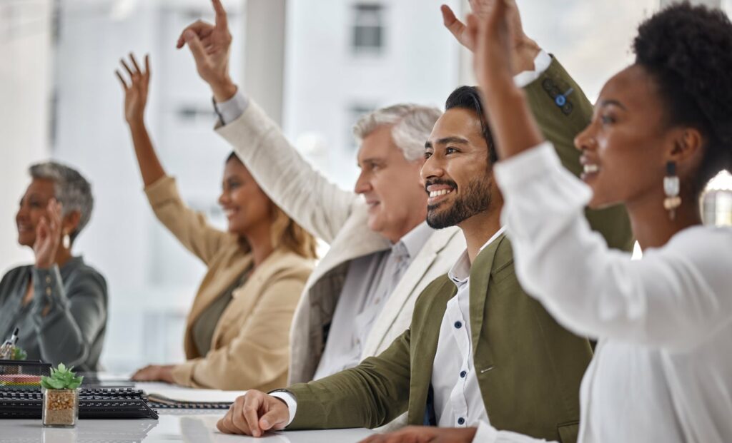 Meeting, seminar and questions with business people hands raised in the boardroom during a strategy session.
