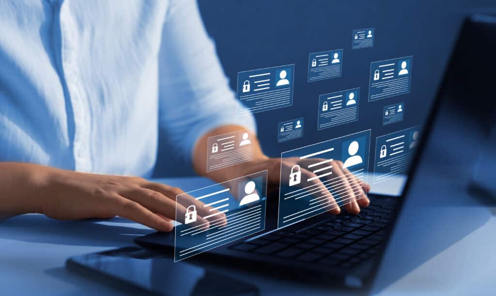 Man on laptop looking at confidential personal information