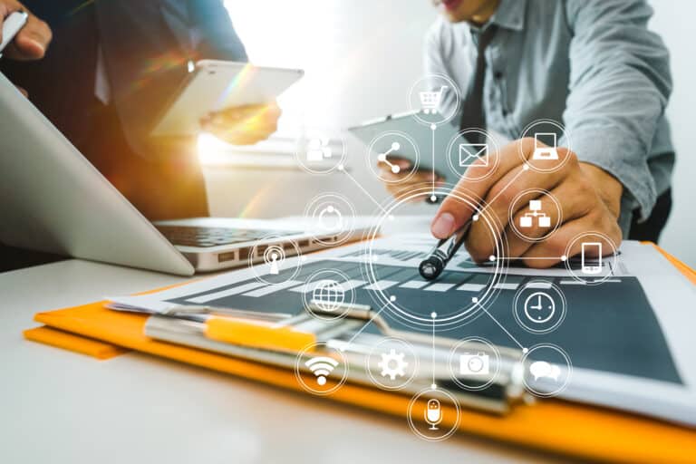 Team business meeting presentation. Hand businessman working project in modern office.Laptop computer and tablet and smart phone on white desk in morning light
